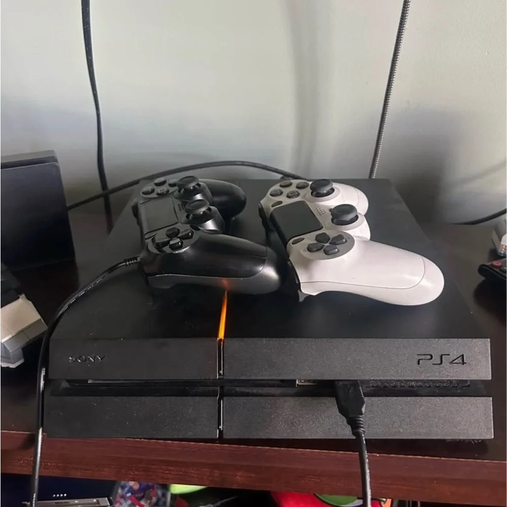 PlayStation 4 with two controllers